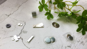 Various types of hidden magnetic snaps by Richarms, including raw, PVC cover, iron cap + PVC cover, and magnetic badge back, in bar, disc, and ring shapes, with NdFeB and ferrite magnets