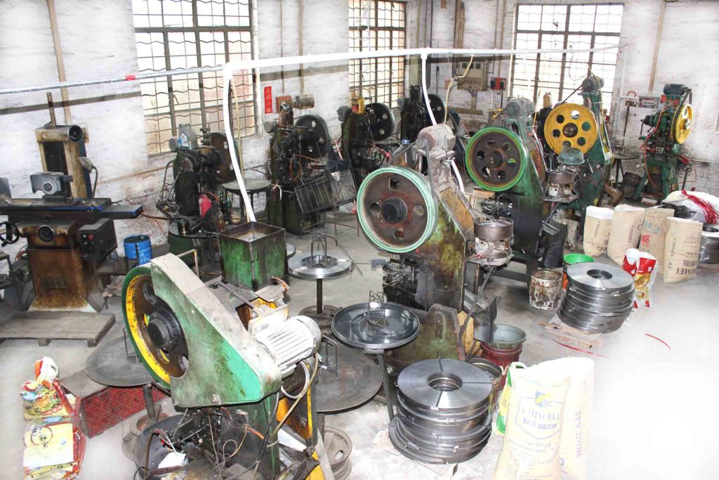 Richarms magnetic snaps Manufacturing workshop with various machines and tools used for production.