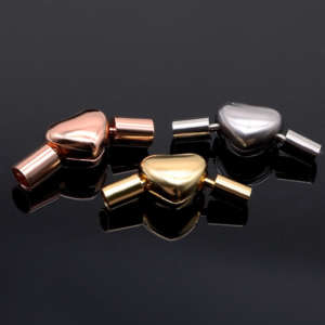 Elegant heart-shaped magnetic clasp for bracelets, designed for a secure and comfortable fit, available in customizable finishes for wholesale buyers.