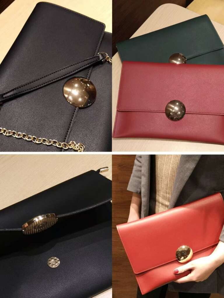 Round disc magnetic lock on a vibrant handheld leather purse, showcasing convenience and style.
