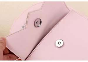 Full Lip Magnetic Snaps used in women's flap handbags, offering secure and stylish closure for fashion accessories.