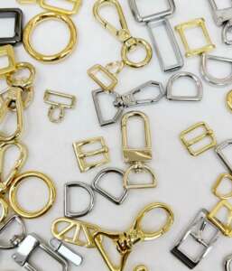 Various types of purse clasps including D-rings, buckles, and snap hooks in gold and silver finishes.