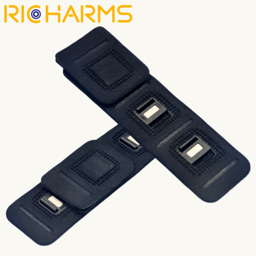 Fabric‑Encased Magnetic Front Clasp, two triple‑unit black fabric‑wrapped magnetic fasteners crossed layout
